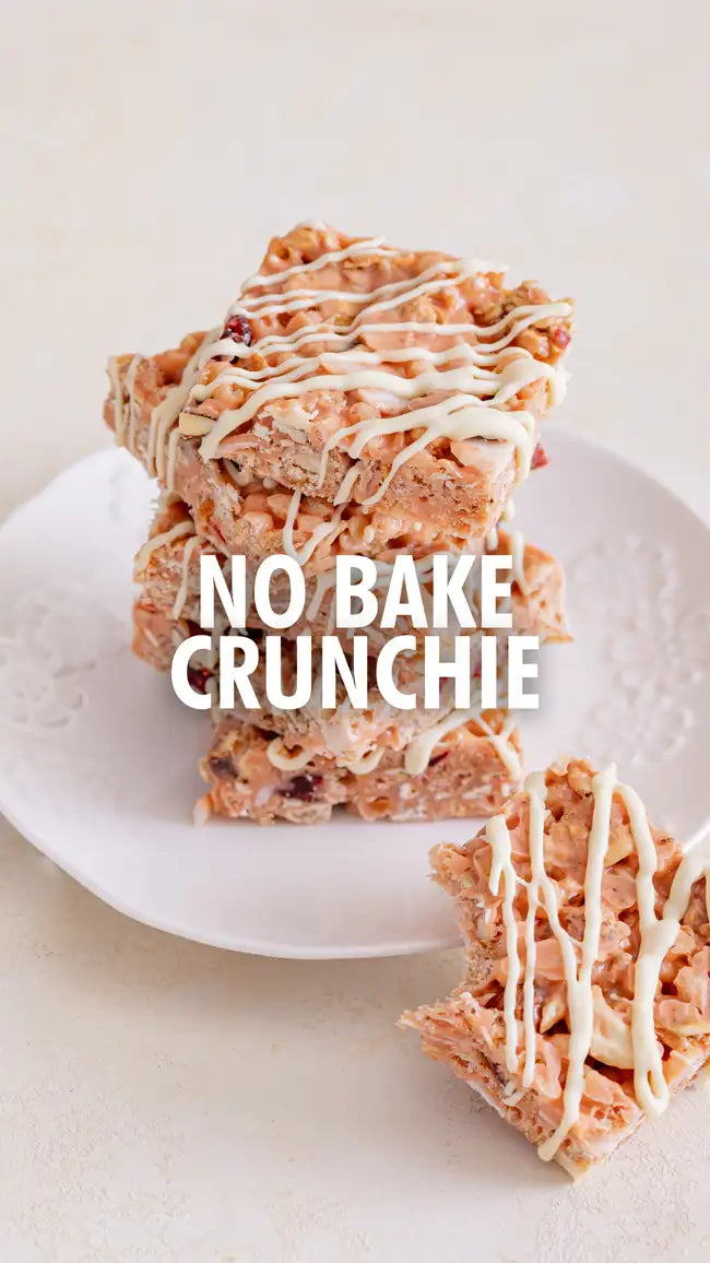 No bake crunchie bar with white drizzle on top, pink and brown cereal base.