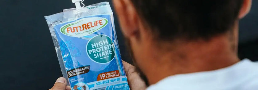 A blue and white futurelife high protein shake pouch with a clear plastic spout, labeled ’double belgian chocolate flavor’ and featuring text indicating it contains 19 vitamins and minerals.