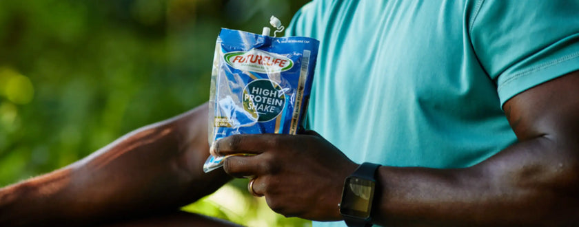 Blue and white high protein snack bar wrapper with silver foil accents.