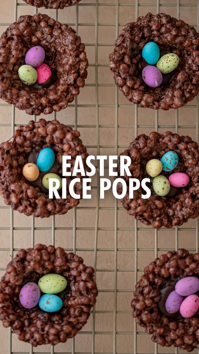 Chocolate-covered rice crispy treat with colorful easter eggs on top.