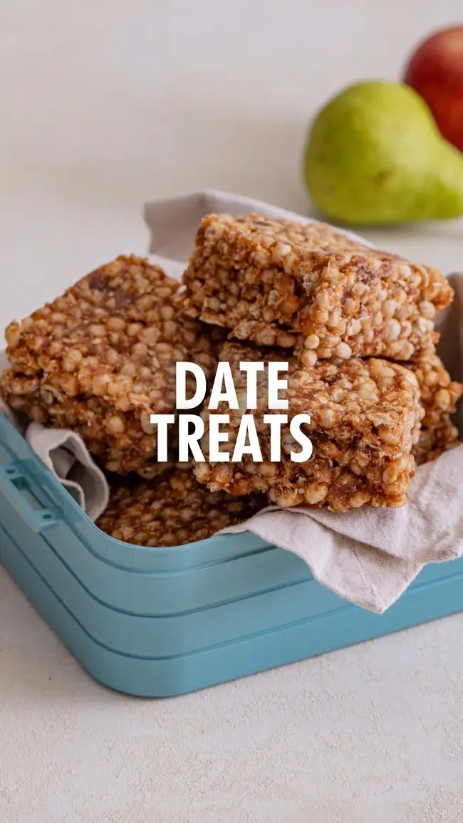 Date treat bar in a blue container with apples and pears.
