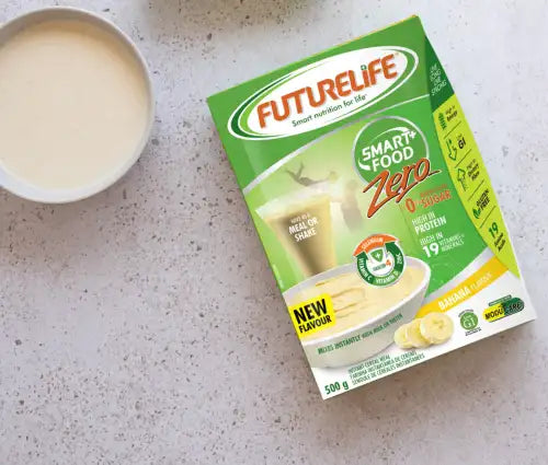 Green and white futurelife smart food zero banana-orange flavor meal replacement powder packet.