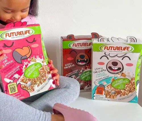 Pink futurelife cereal box featuring a cartoon bear with closed eyes and heart-shaped nose, designed for kids’ breakfast.