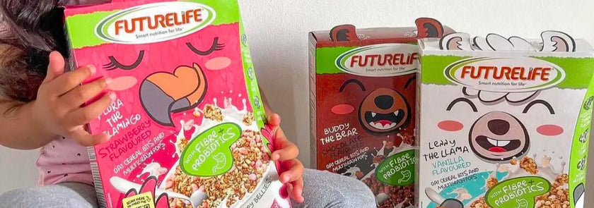 Pink futurelife cereal box featuring a cartoon llama with closed eyes and heart-shaped nose, labeled ’strawberry & vanilla’ flavor.