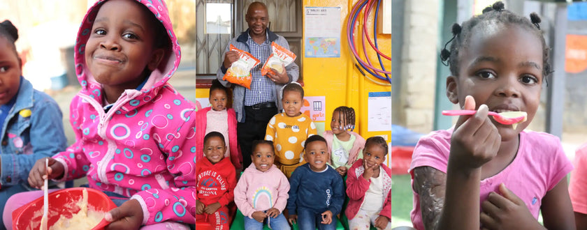 Pink polka dot hoodie with white circles and red drawstring.