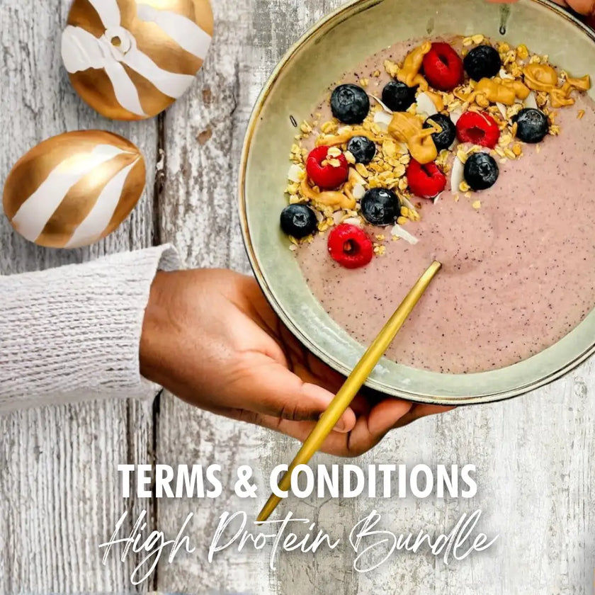 A pink smoothie bowl topped with blueberries, raspberries, granola, and peanut butter drizzle.