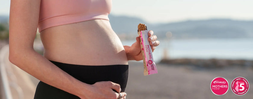 Pink and white protein bar with chocolate chip design, 15g of protein per serving.