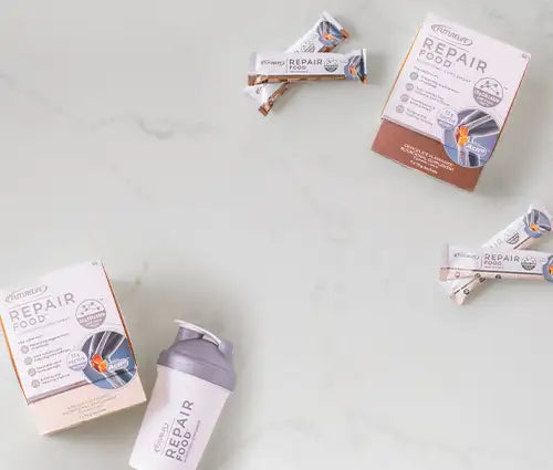 Repair food protein powder shaker bottle with gray lid and white label featuring orange accents.